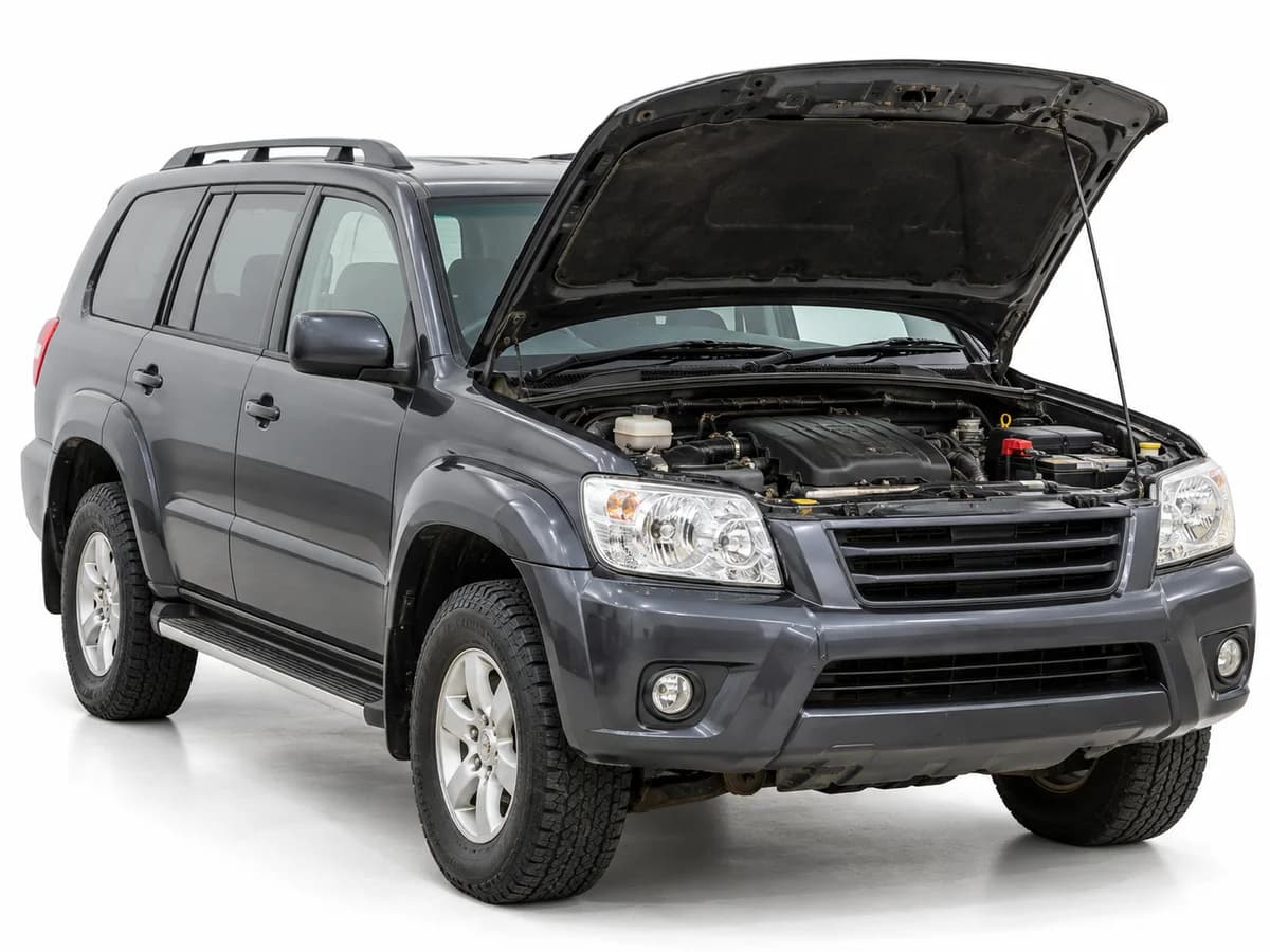 A grey 4WD with its bonnet open for a condition inspection