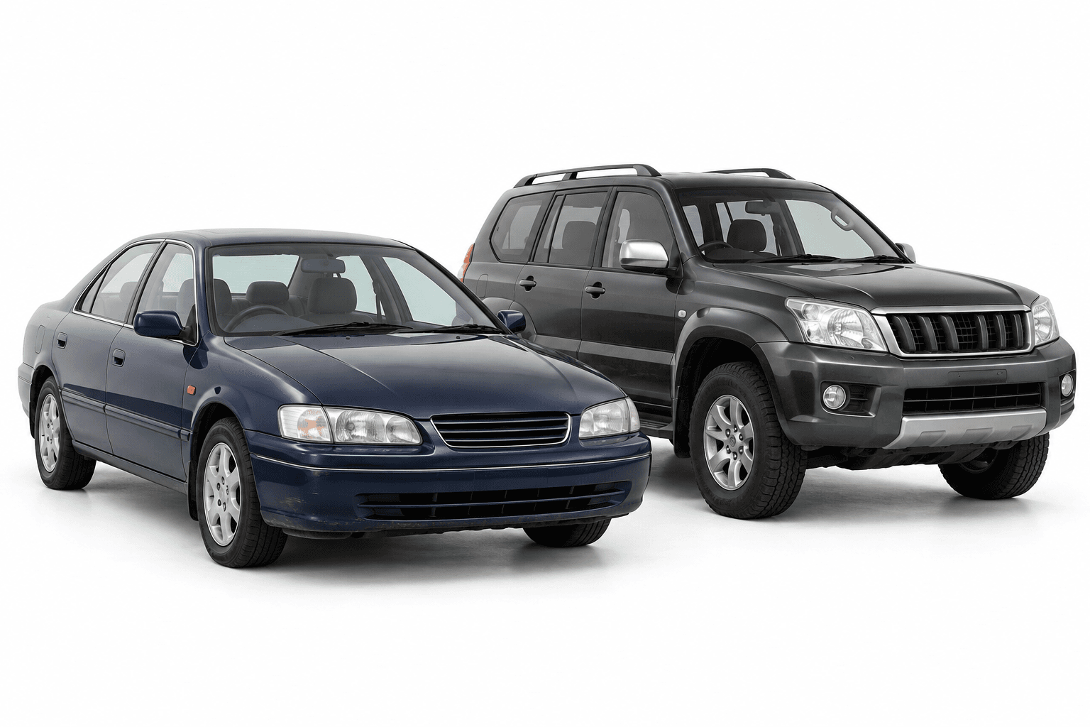 An older blue sedan and a charcoal 4WD on a white background